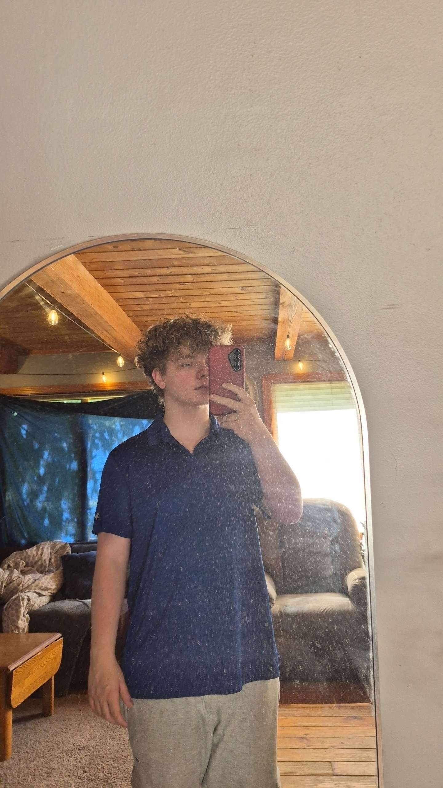 Bryce N standing in front of a mirror